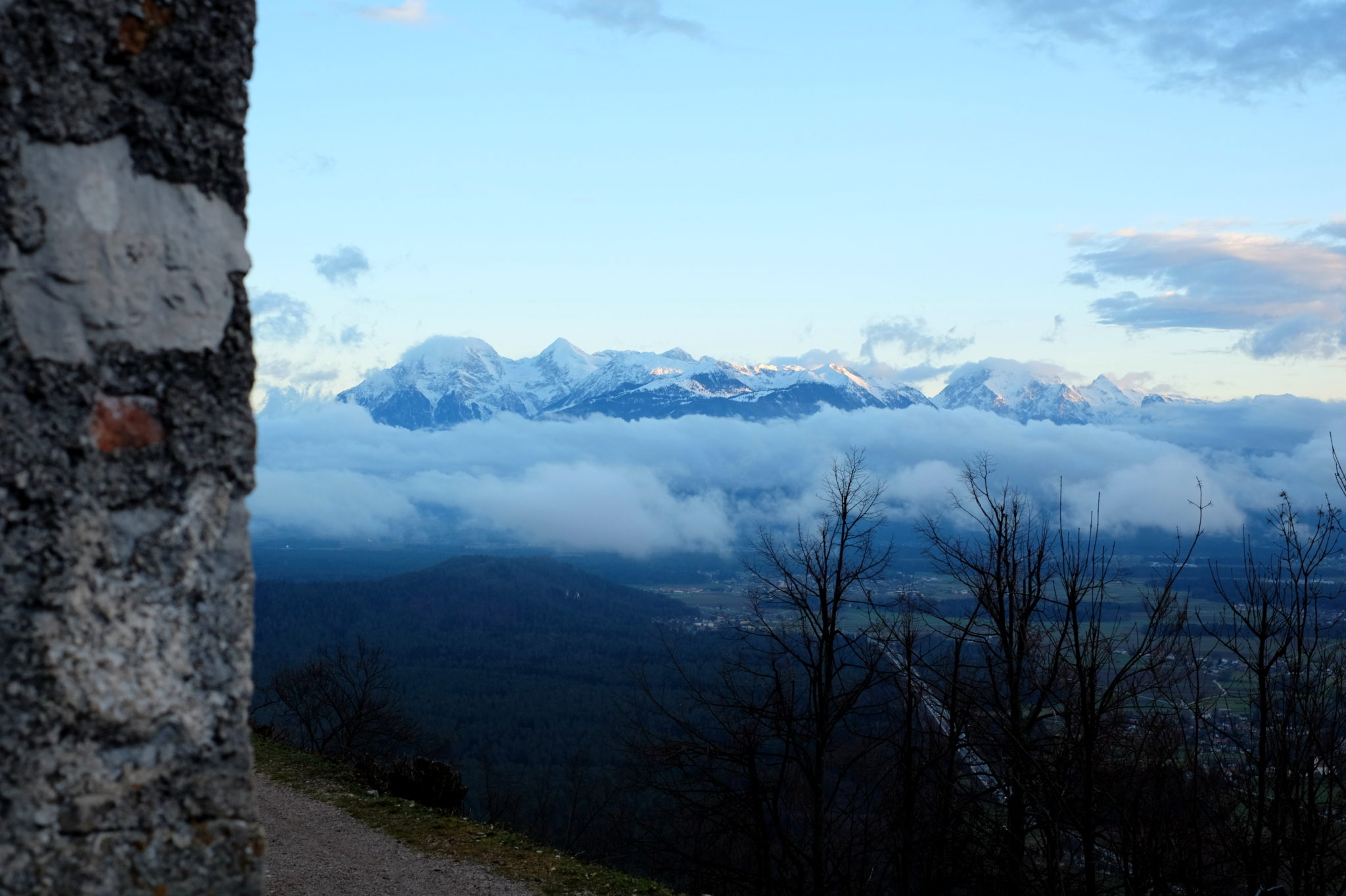 The Kamnik-Savinja Alps take their time and wake up slowly on cloudy days like this, making a spectacle of their own for Šmarna Gora visitors. Photo by: Exploring Slovenia.