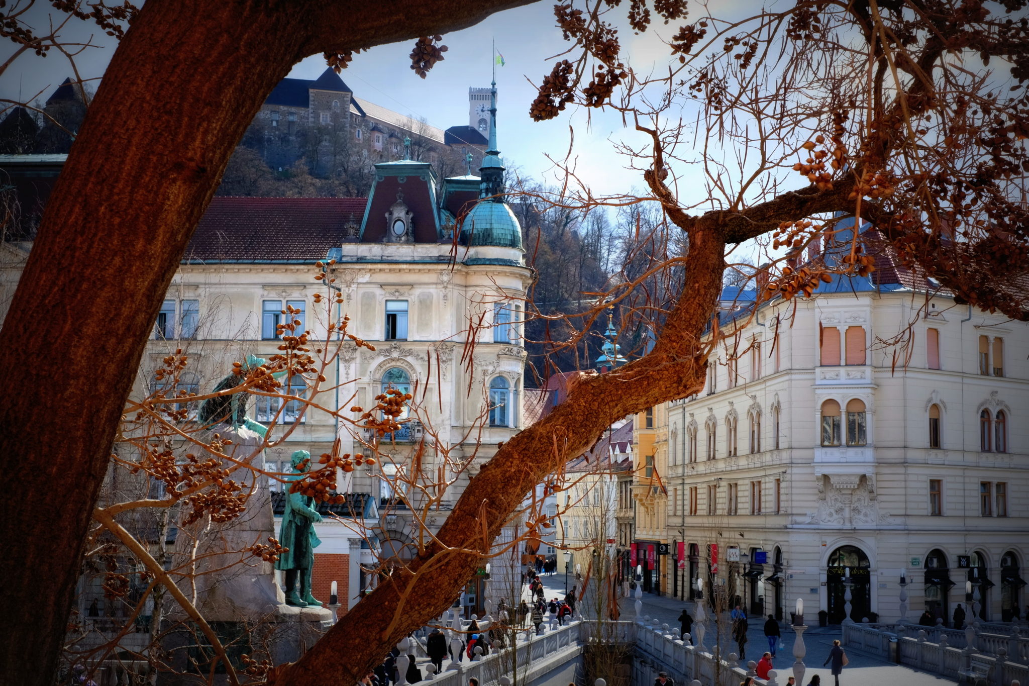 Ljubljana Castle and the Triple Bridge, which connects the historical town on one bank with the modern city on the other. Photo by: Exploring Slovenia.