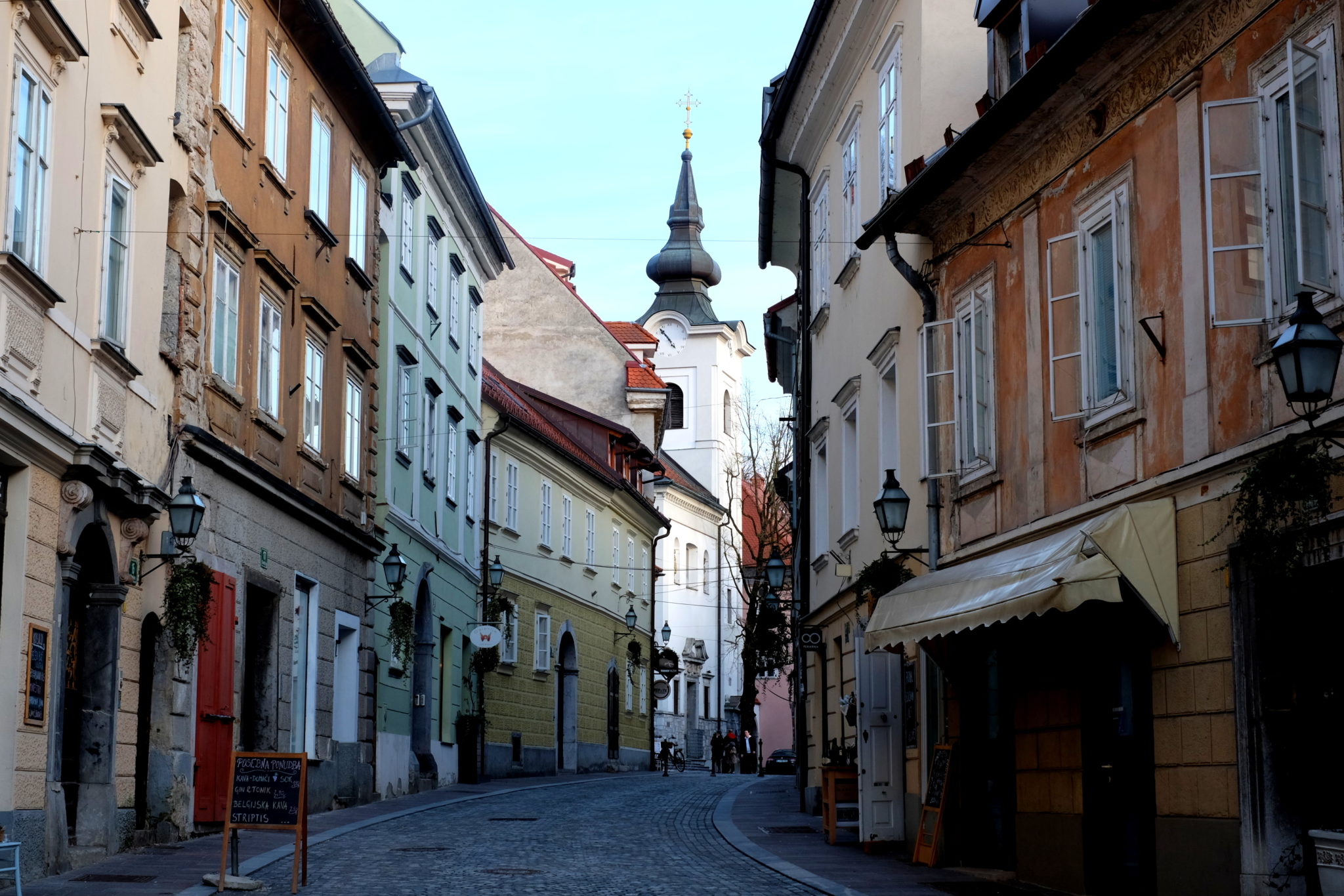 The most scenic way to the castle is from the Gornji Trg square at the beginning of the historic city center. It takes a turn to the left right before the church in the picture. Photo by: Exploring Slovenia.