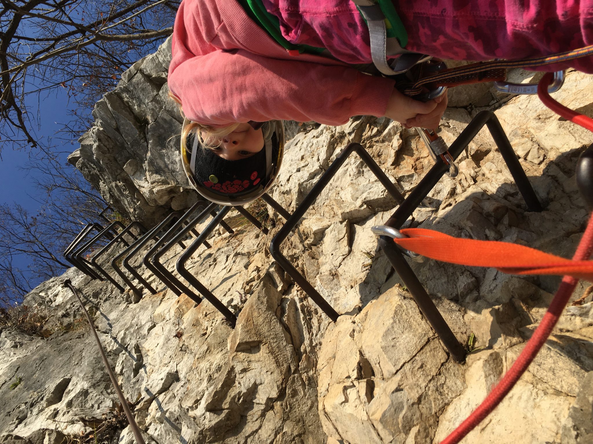 Kids love climbing via ferrata, but make sure you use recommended safety gear like a helmet, a lanyard protection system, and a harness. Photo by: Exploring Slovenia.