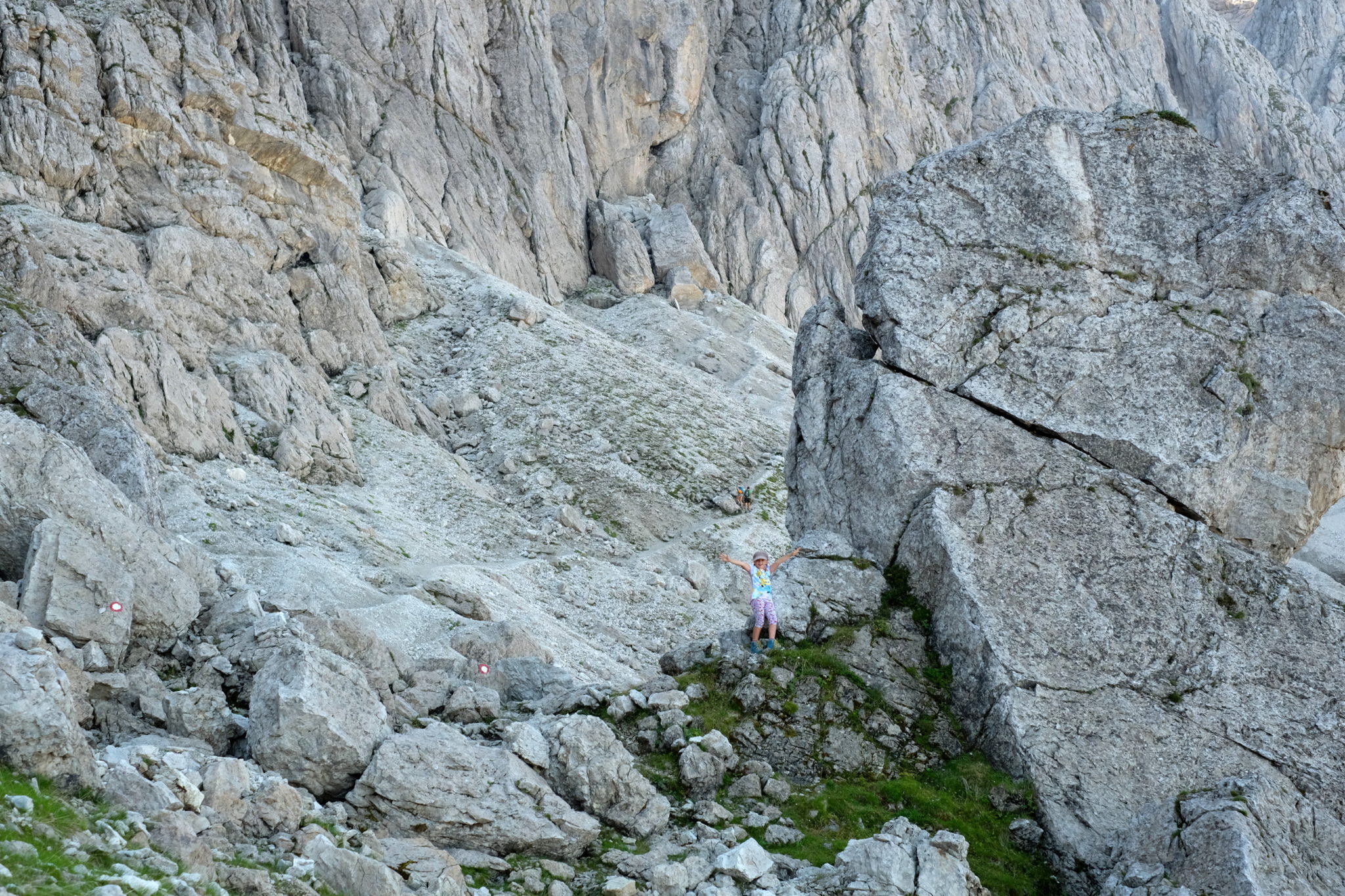 A small kid in big mountains.