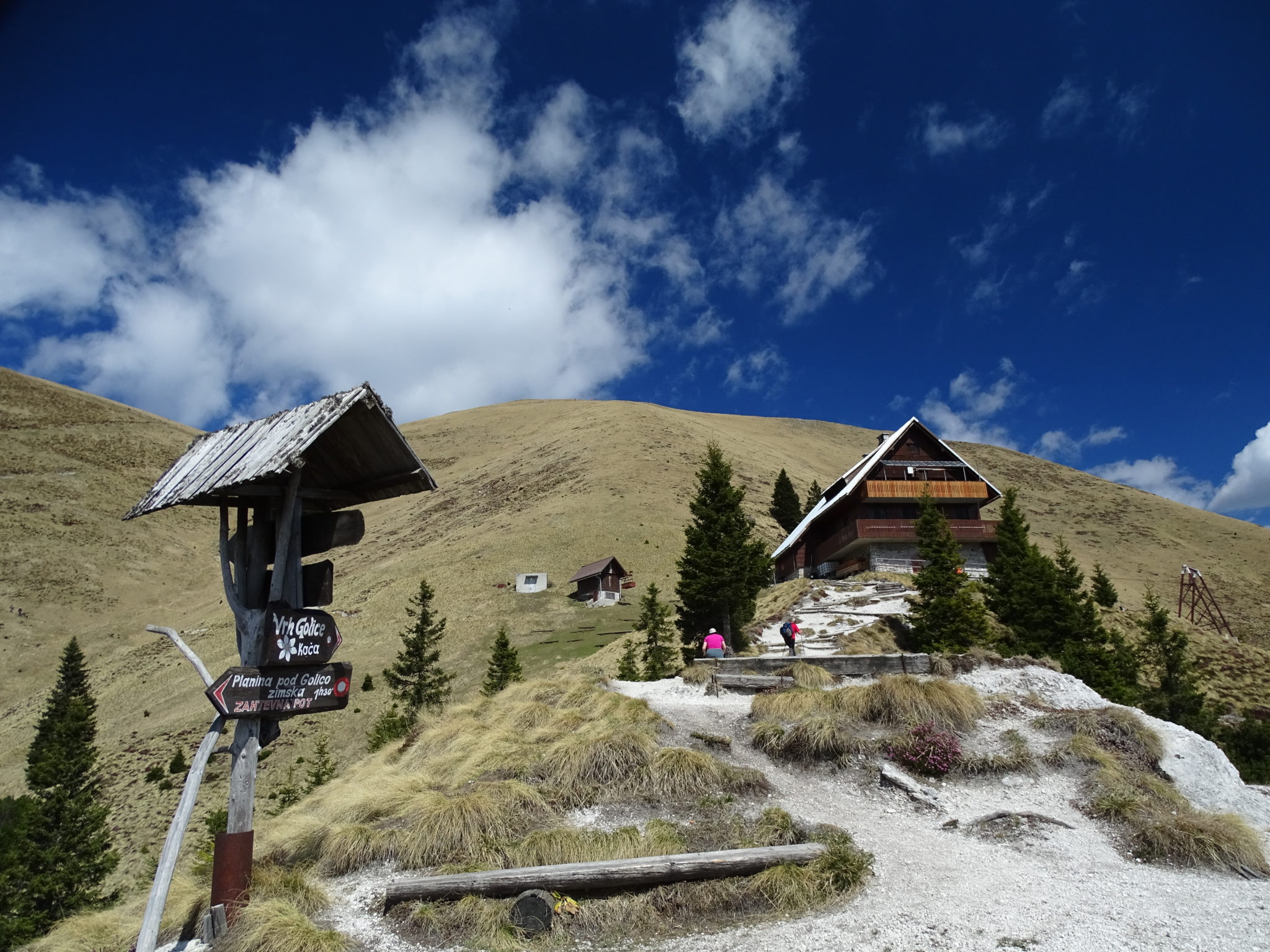 A mountain hut, mountains, sun