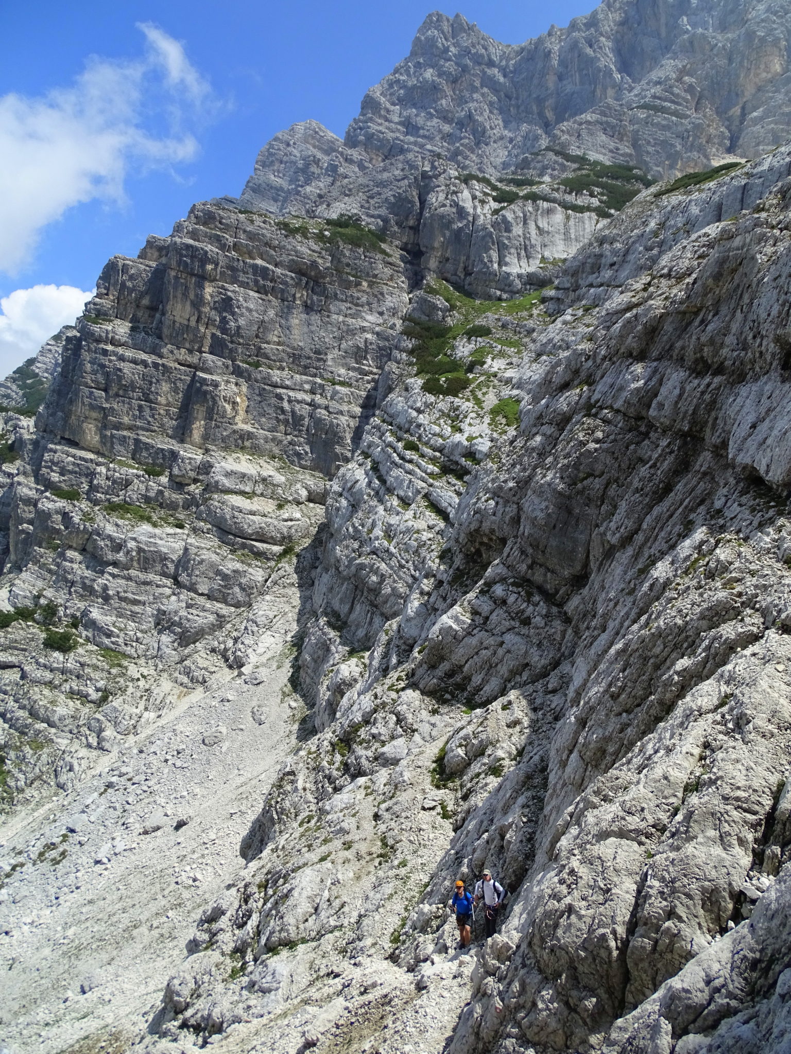 Two hikers going up to Triglav over the Prag Route