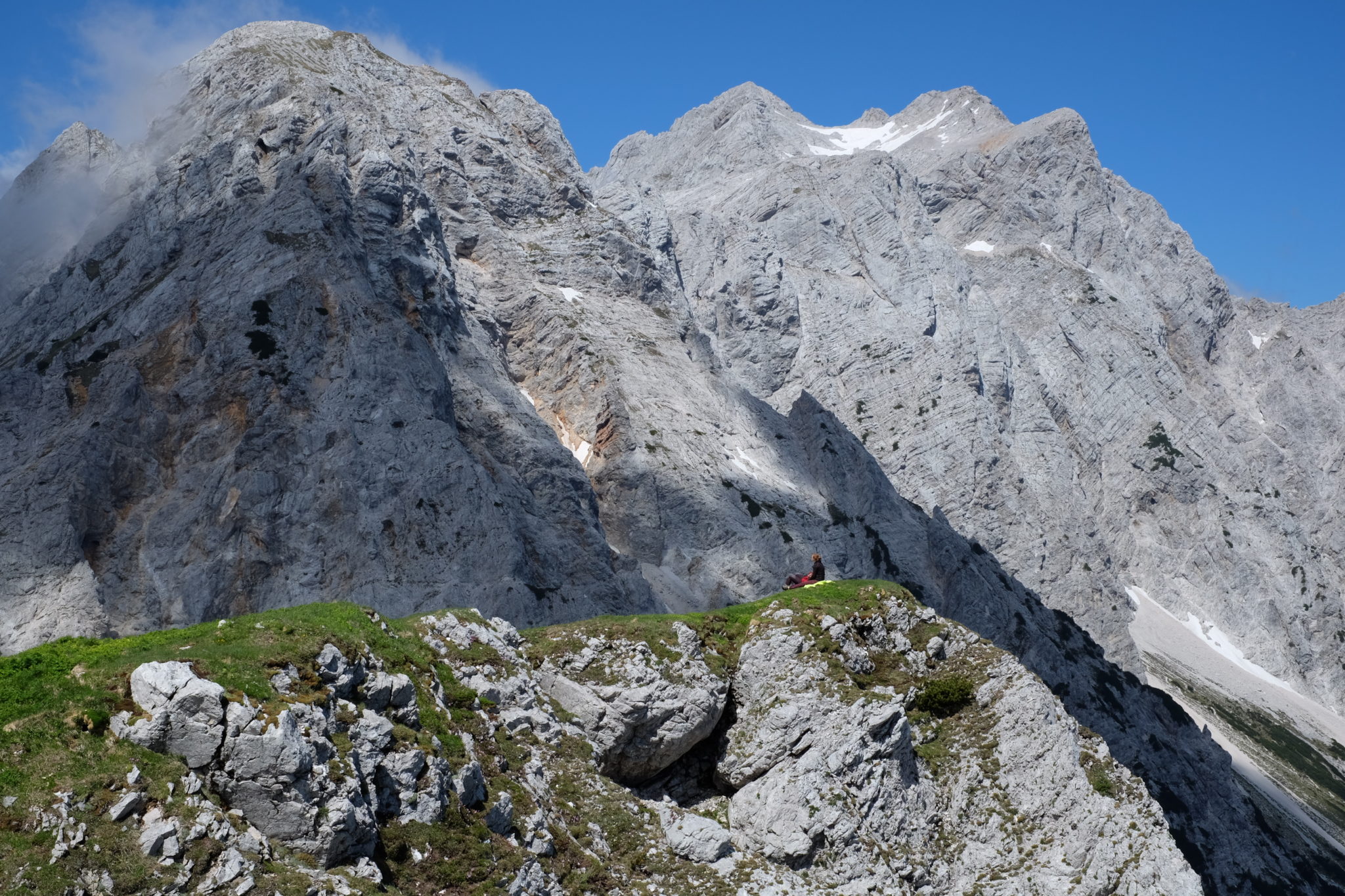 Two hikers resting after a long hike in the mountains