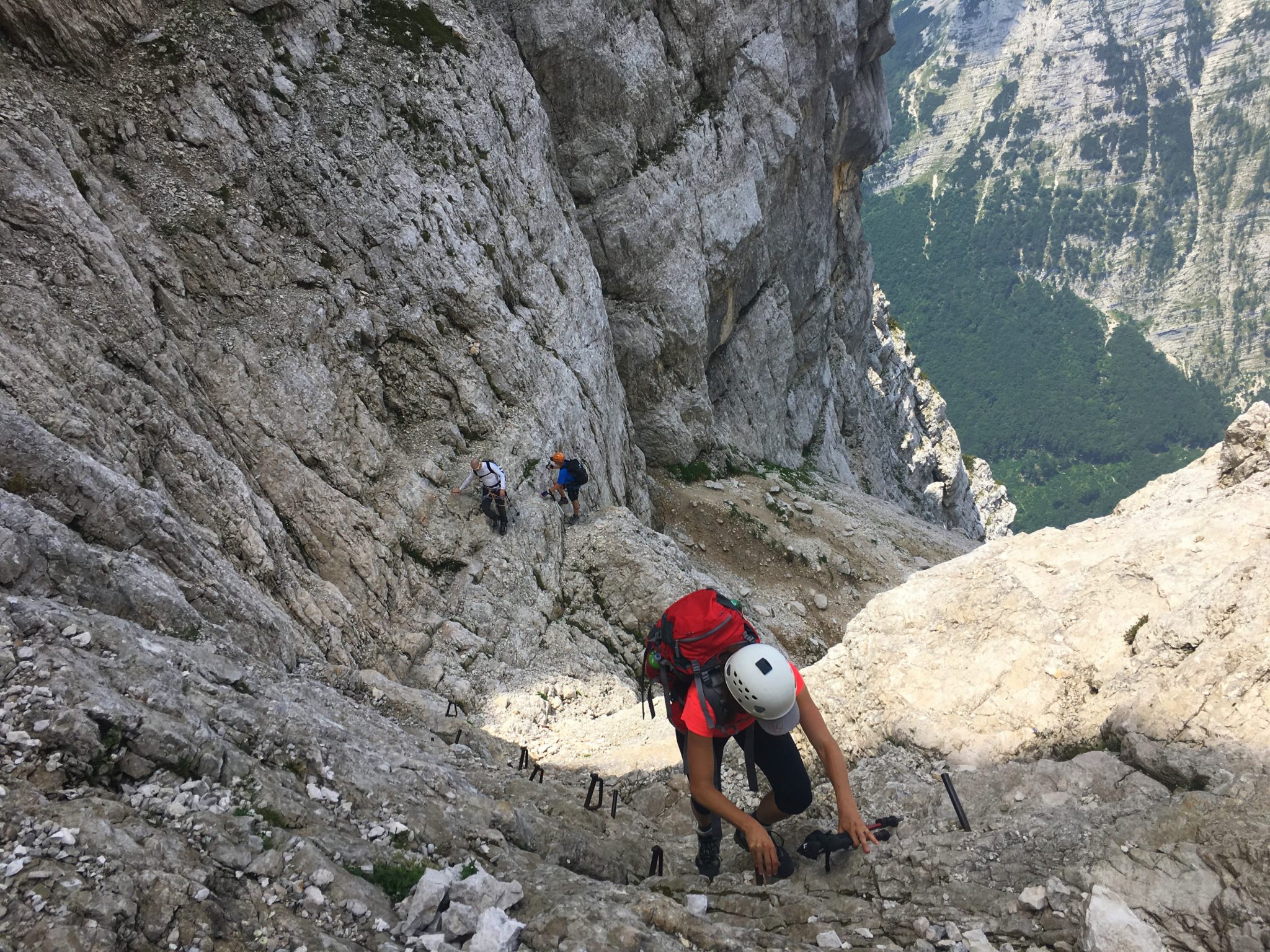 A female hiker climbing up to Triglav over the Prag Route