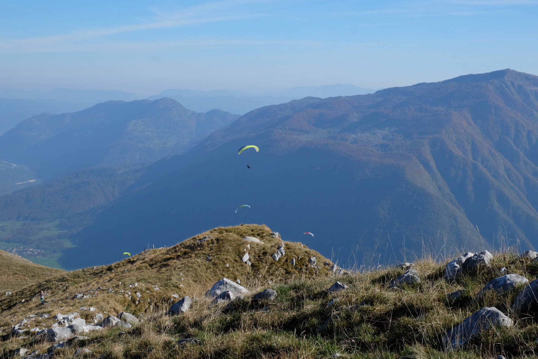 Kobariški Stol is also favored by paragliders and downhill riders. If we hiked up as a family, my 20-years-old nephew Lovro brought along his paraglider and jumped from just beneath the top of Kobariški Stol towards Kobarid. Slovenia