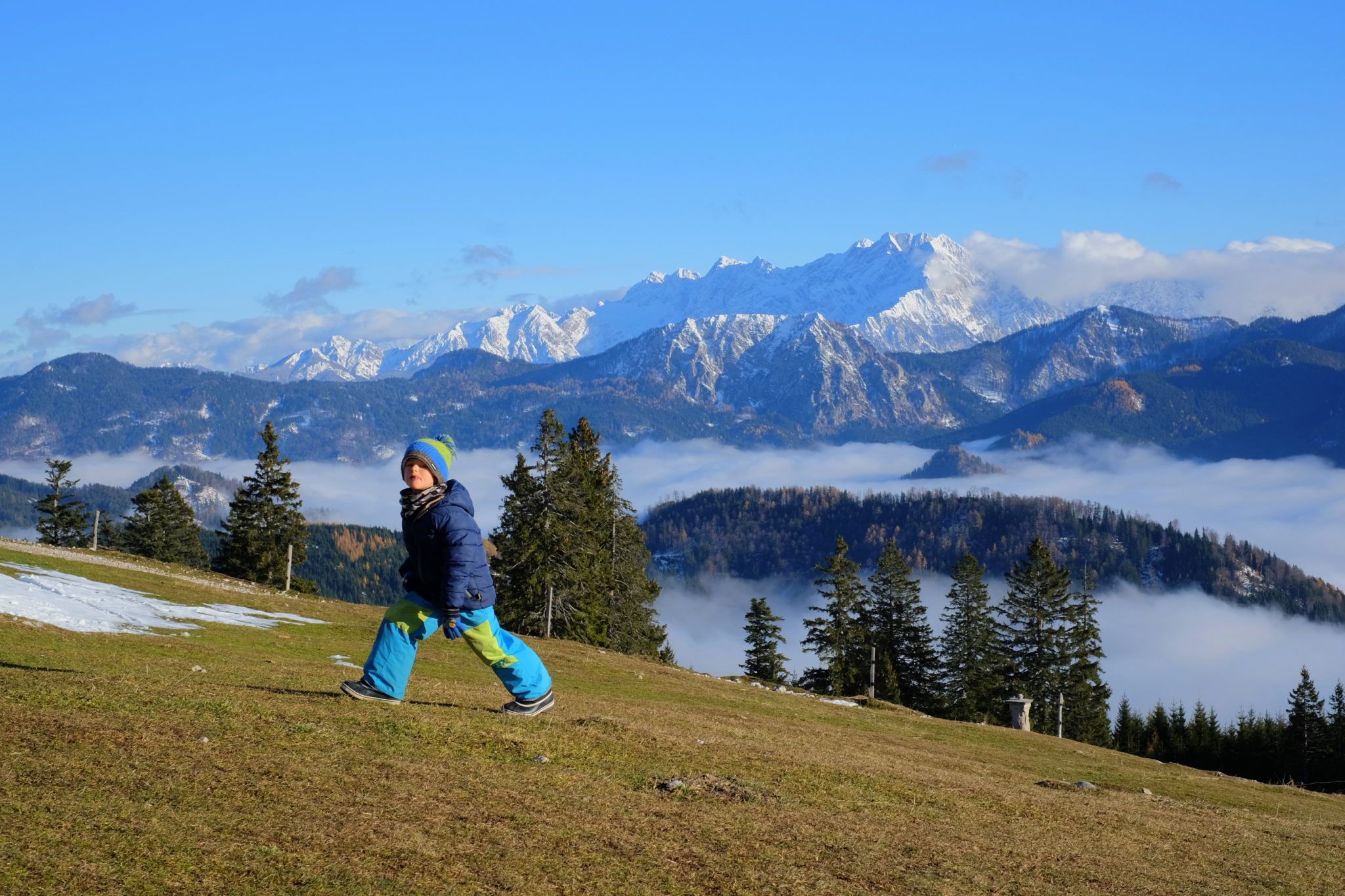 A little boy hiking in the mountains, Slovenia, sunny day