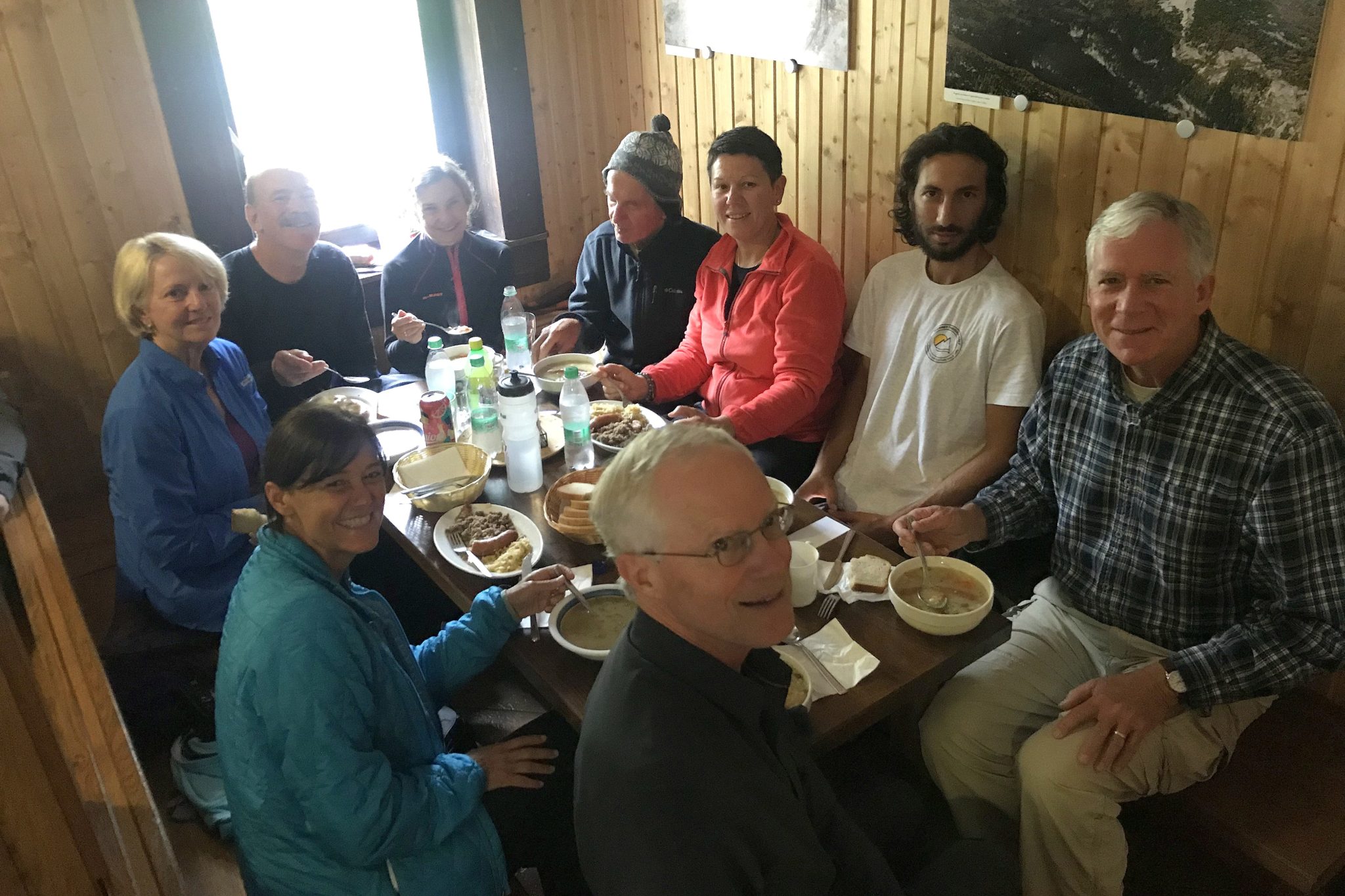 Our group of hikers eating lunch in the hut