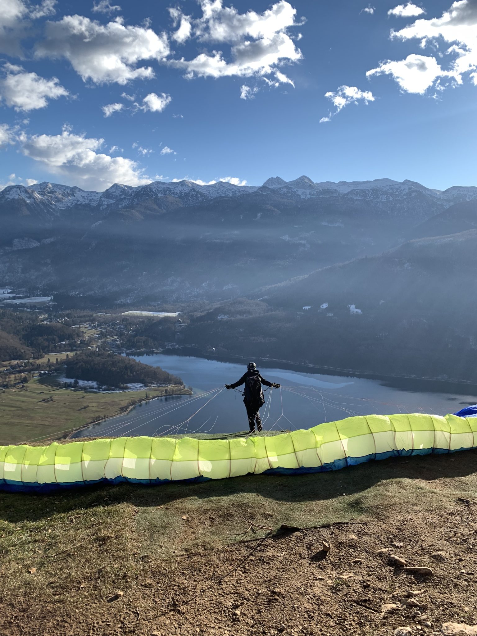 A paraglider taking off above Lake Bohinj, Julian Alps, mountains, Slovenia